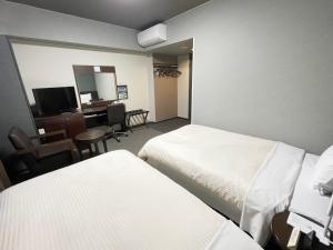 TV a/nebo společenská místnost v ubytování Hotel Route-Inn Dai-ni Ashikaga