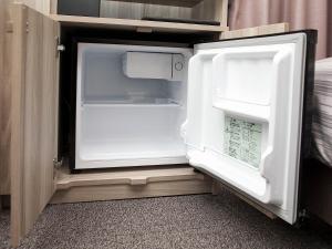 Postel nebo postele na pokoji v ubytování Hotel Route-Inn Dai-ni Ashikaga