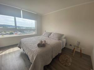 Ένα ή περισσότερα κρεβάτια σε δωμάτιο στο Depto Parque Víctor lamas +11 φωτογραφίες