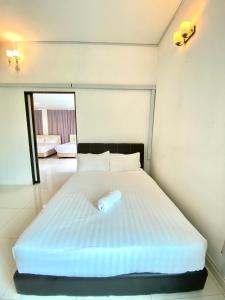 Postel nebo postele na pokoji v ubytování Seahome Boutique Hotel