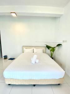 Postel nebo postele na pokoji v ubytování Seahome Boutique Hotel