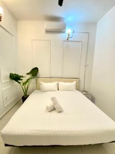 Postel nebo postele na pokoji v ubytování Seahome Boutique Hotel
