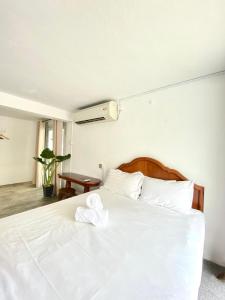 Postel nebo postele na pokoji v ubytování Seahome Boutique Hotel