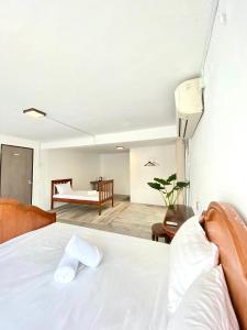 Postel nebo postele na pokoji v ubytování Seahome Boutique Hotel