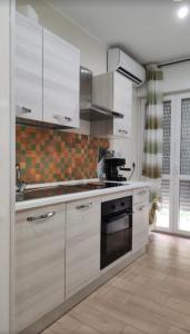 Kuchyň nebo kuchyňský kout v ubytování B&B Suite Penelope