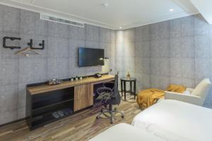 TV a/nebo společenská místnost v ubytování CU Hotel Kaohsiung