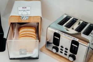 a toaster with two slices of bread in it at Mary MacKillop Place in Sydney