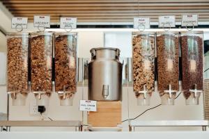 a display of granola in jars on a shelf at Mary MacKillop Place in Sydney