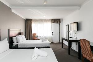 Lova arba lovos apgyvendinimo įstaigoje Checkers Resort