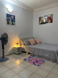 Ένα ή περισσότερα κρεβάτια σε δωμάτιο στο Lumena résidence