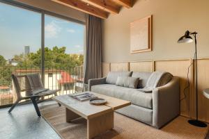 a living room with a couch and a table at ONTO Alvaro Obregon Mexico City in Mexico City