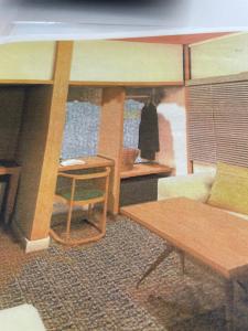 a living room with a couch and a table at Shiunso in Nikko