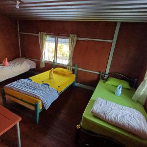 Postel nebo postele na pokoji v ubytování Lungmin homestay
