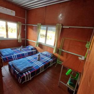 Postel nebo postele na pokoji v ubytování Lungmin homestay