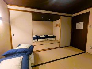 a small room with two beds in a room at Misono no Oyado - RO 美園のおやど - ろ #IO2 in Wakayama +52 photos