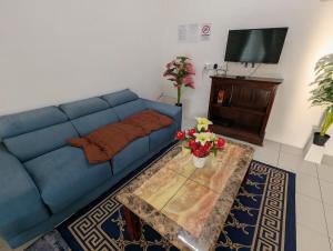 TV a/nebo společenská místnost v ubytování HOMESTAY IBUNDA Sabak Bernam