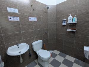 Koupelna v ubytování HOMESTAY IBUNDA Sabak Bernam + 8 fotografií
