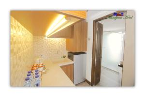Kuchyň nebo kuchyňský kout v ubytování Rumah Kandjani By Makati + 31 fotografií
