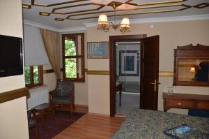 TV a/nebo společenská místnost v ubytování Aruna Boutique Hotel