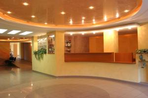 a lobby with a waiting area in a building at Obiekt Tatar - Usługi Hotelarskie in Rawa Mazowiecka