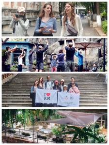 昆明Kunming Upland International Youth Hostel ,near the city center ,2 mins walk to the subway, 2 mins walk to the Green Lake, Close to Yuan tong Temple, Old street, Yunnan University, convenient payment and visa cards are accepted的一群人站在台阶上举起标志