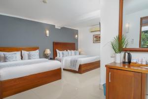 Letto o letti in una camera di Hotel Travellers Nest Kandy