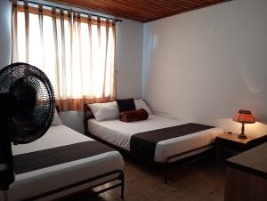 Hotel Alpino Armenia客房内的一张或多张床位