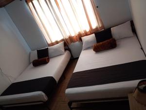 Hotel Alpino Armenia客房内的一张或多张床位
