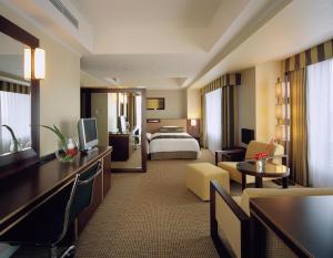 Hotel Okura Kyoto tesisinde bir odada yatak veya yataklar