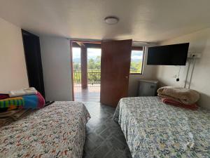 Postel nebo postele na pokoji v ubytování Hostal Inn II Rionegro + 37 fotografií