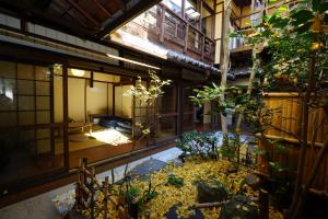 a room with a pool in the middle of a building at Hotel Lantern Gion in Kyoto