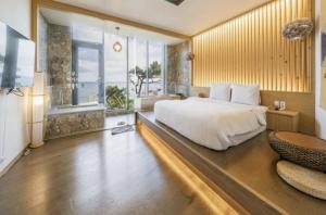 One fine day Jeju Poolvilla客房内的一张或多张床位