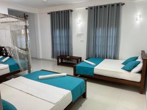 Letto o letti in una camera di Azure Resort Mirissa