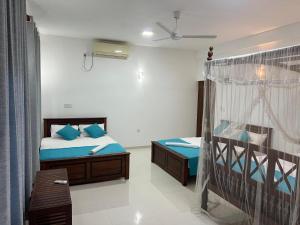 Letto o letti in una camera di Azure Resort Mirissa