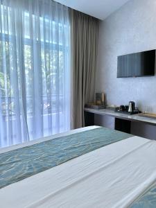 Postel nebo postele na pokoji v ubytování La Fattoria Resort