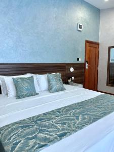 Postel nebo postele na pokoji v ubytování La Fattoria Resort
