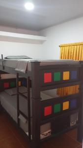 a bunk bed with colorful paint on it in a room at Apartamento #5 in Puerto Colombia