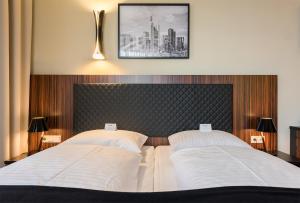 Cama ou camas em um quarto em The Frankfurt