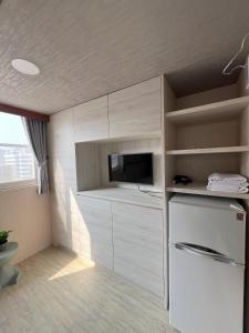 Kuchyň nebo kuchyňský kout v ubytování Love River Inn 愛河日央