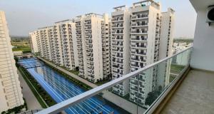 a view of some apartment buildings from a balcony at Ayaansh Resort- Westin Sohna Complex 1 - 3 - 4- 7 - BHK in Sohna