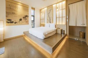 One fine day Jeju Poolvilla客房内的一张或多张床位