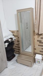 a bathroom with a large mirror on a stand at Apartamento #7 in Puerto Colombia +28 photos