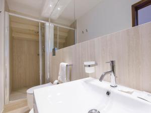 a bathroom with a sink and a toilet and a mirror at Nonna Jole in Lecce