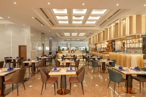 an image of a restaurant with tables and chairs at PANAMA Nha Trang Hotel in Nha Trang