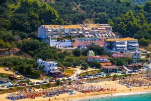 an aerial view of a beach with a crowd of people at Aperanto House Paralia Loutsas in Loutsa
