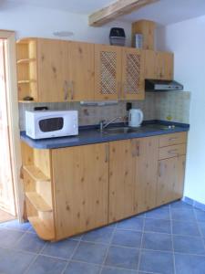 Kuchyň nebo kuchyňský kout v ubytování Apartmány Yellow