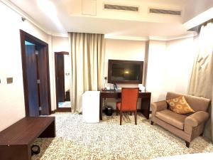 Телевизор и/или развлекательный центр в Grand Legacy Hotel Doha