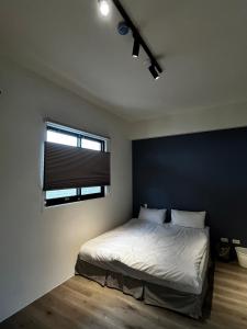 Postel nebo postele na pokoji v ubytování WuYou Guesthouse