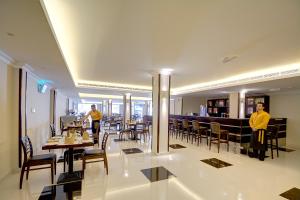 A restaurant or other place to eat at Ajman Beach Hotel