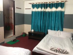 Letto o letti in una camera di HOTEL TRILOK
